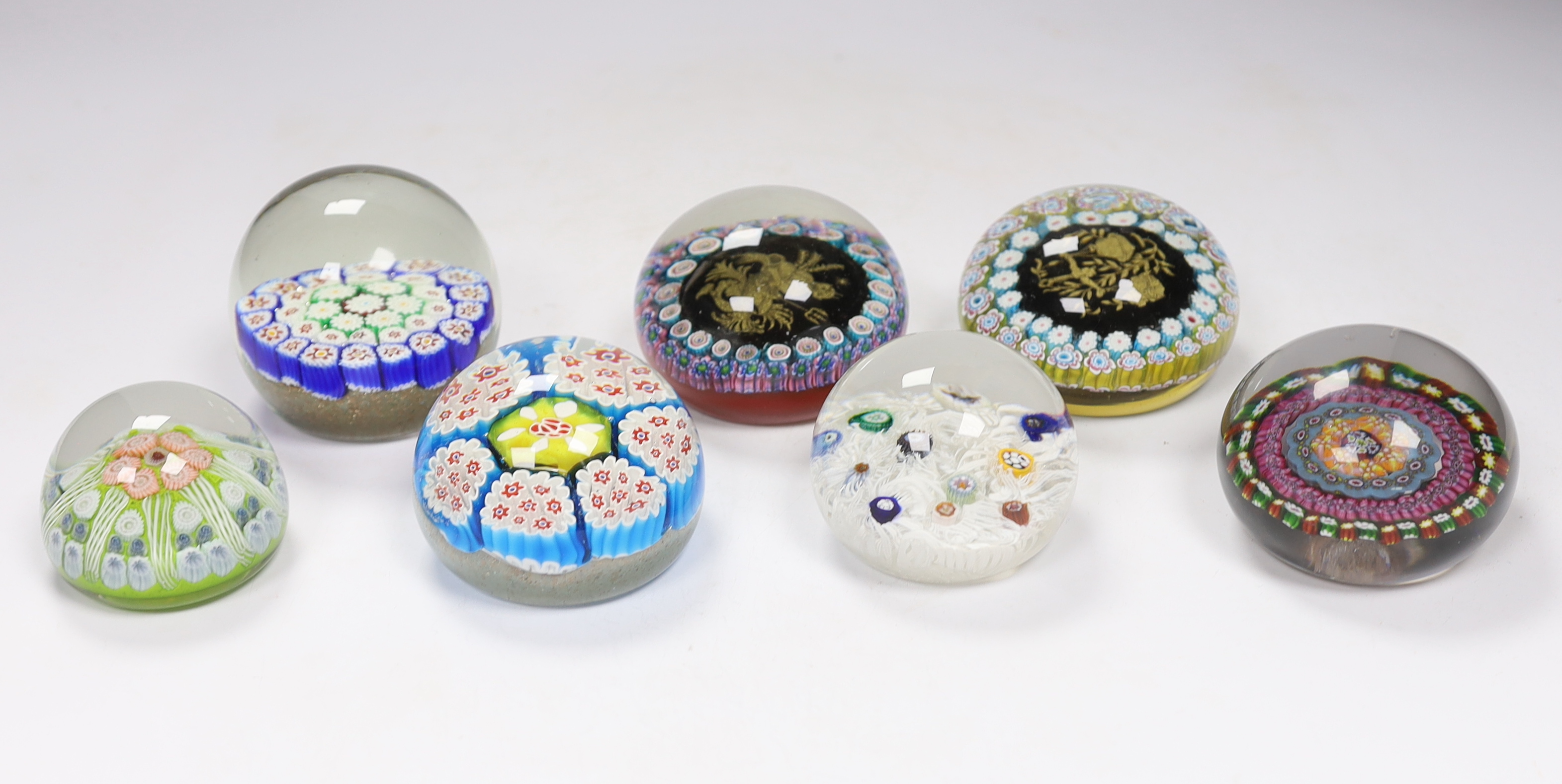 Seven various glass millefiori paperweights, Murano etc.